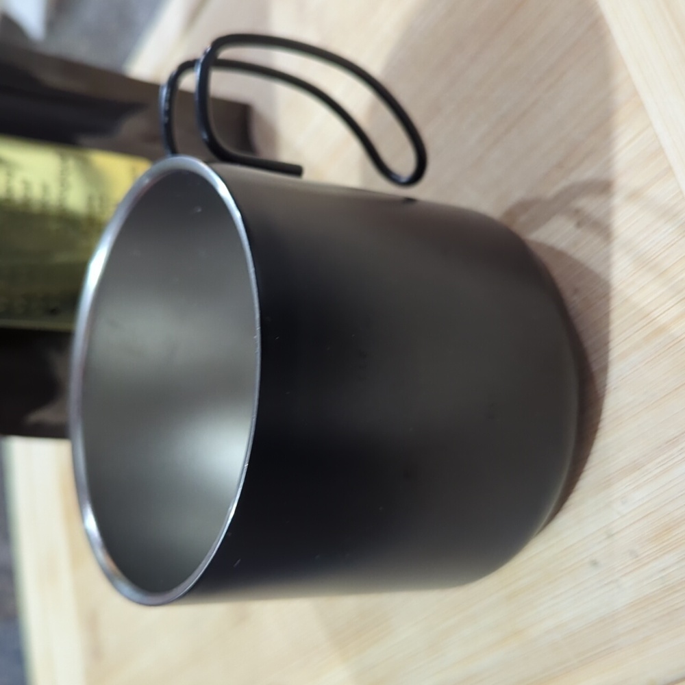 Starbucks black stainless steel espresso mug.
